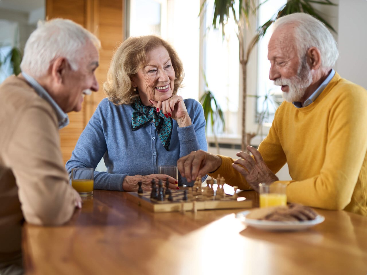 Assisted living residents playing a game of chess