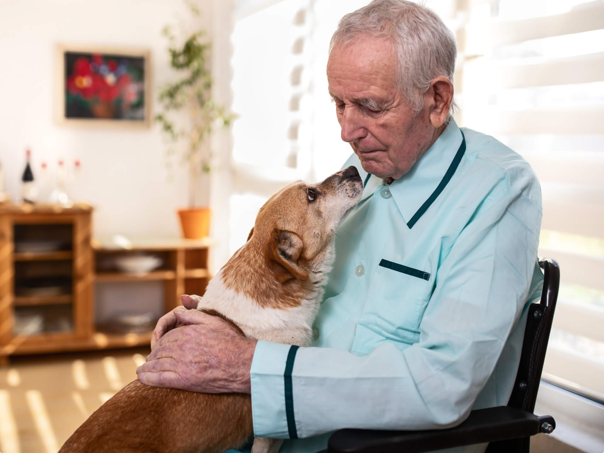 assisted living resident holding a dog