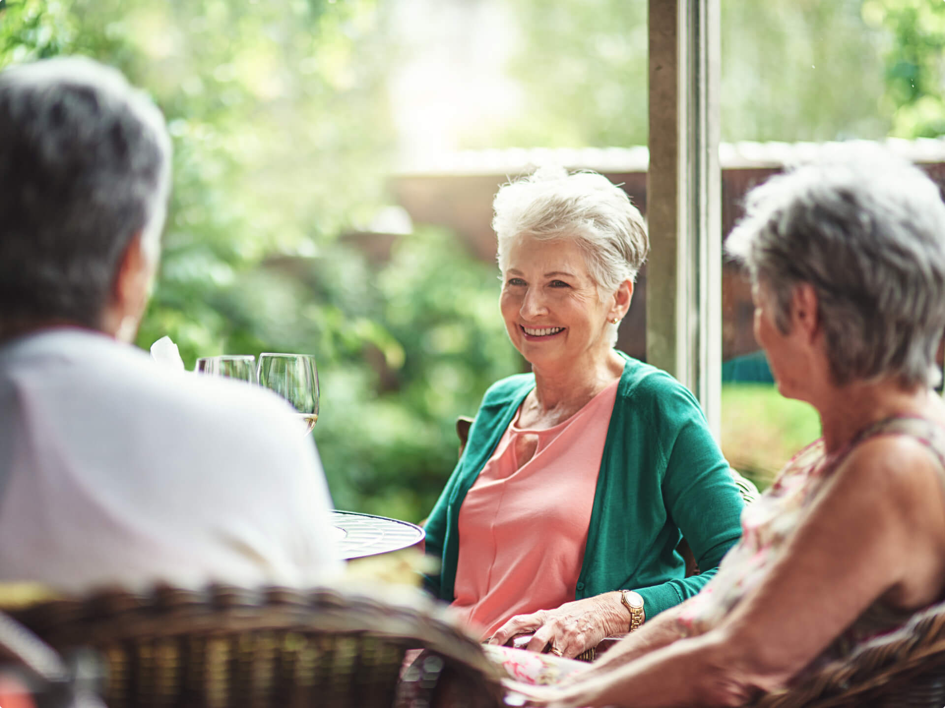 Women in independent living community socializing at a table