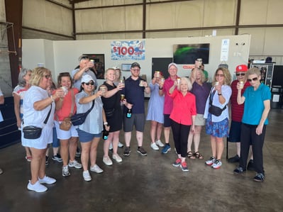 Charlotte celebrates with friends and family after a successful skydive.