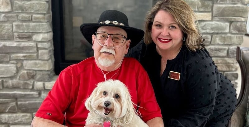 Gene Beard and Ellie smiles for photo with Cedarhurst worker