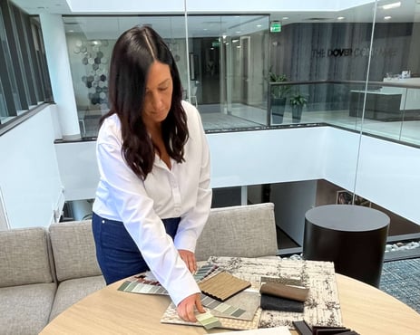 interior designer looking at color and fabric swatches for senior living communities.