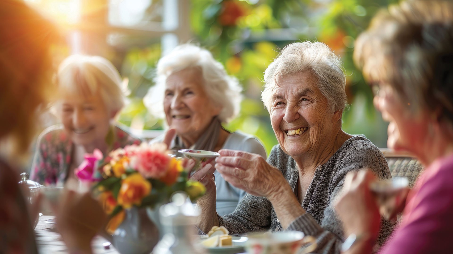 Senior women drinking tea outside