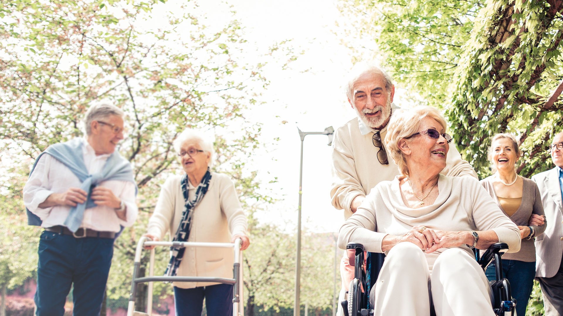 Senior living residents walking outside