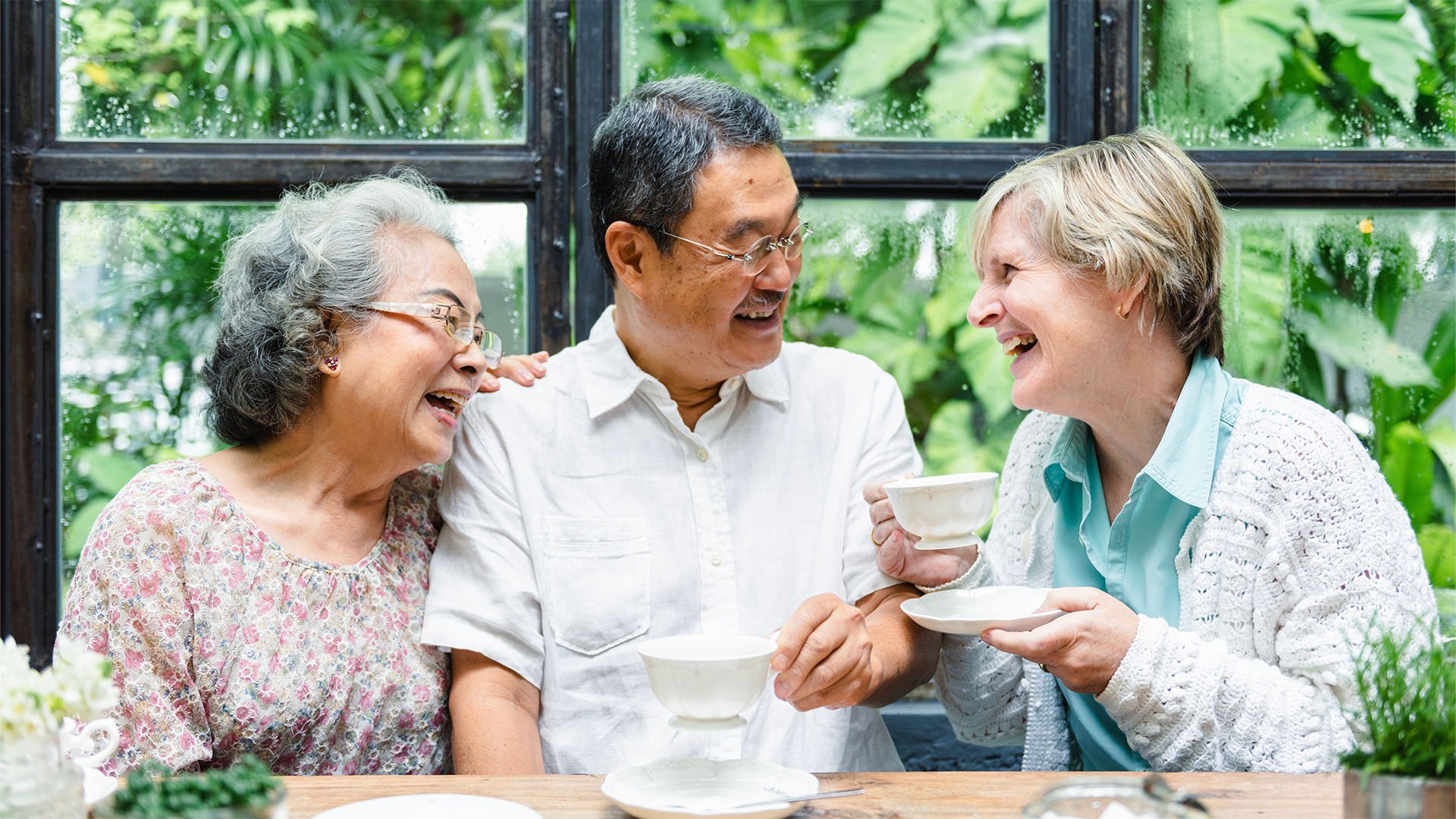 Senior living residents chatting outside