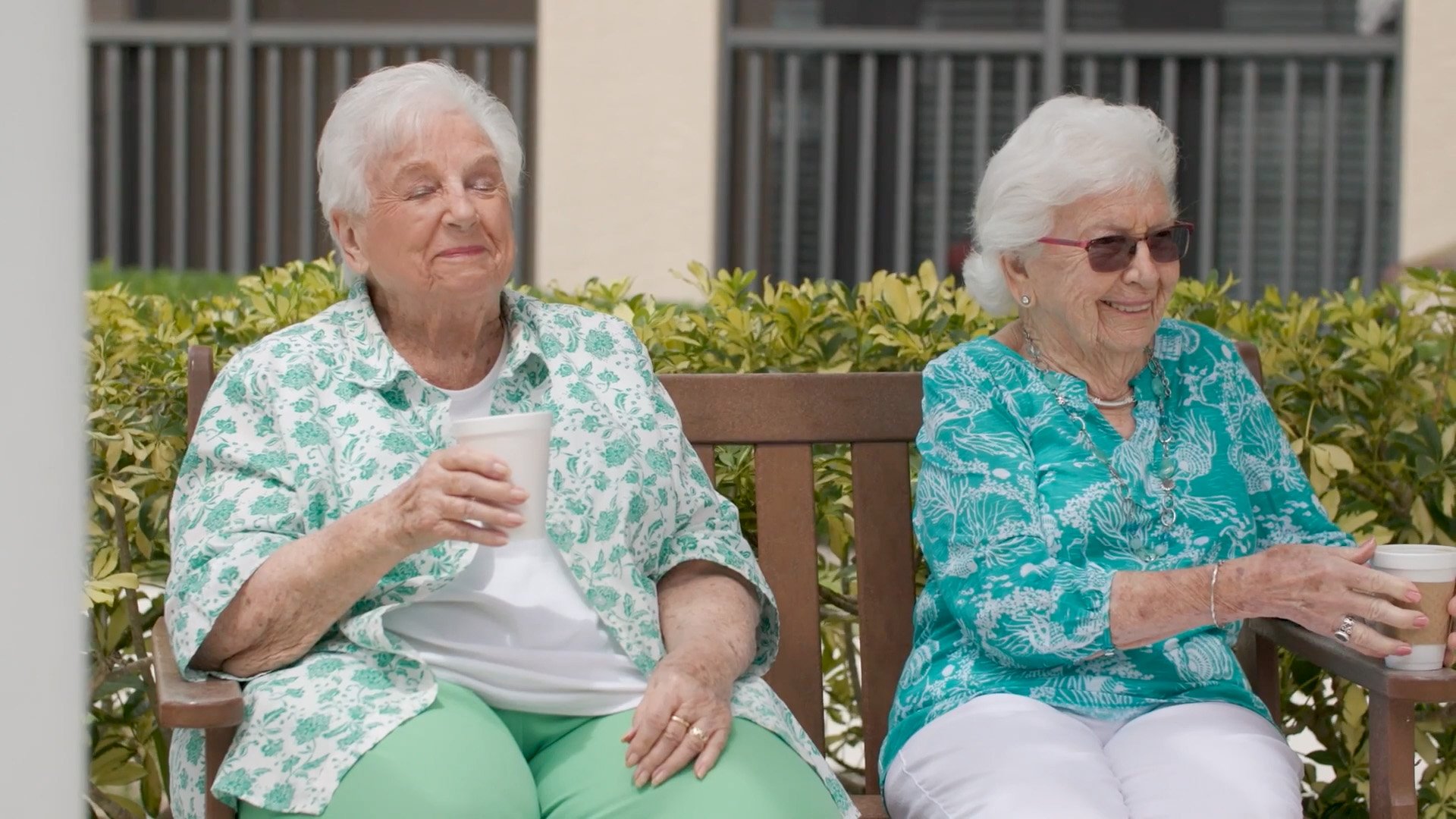 Senior living residents sitting outside