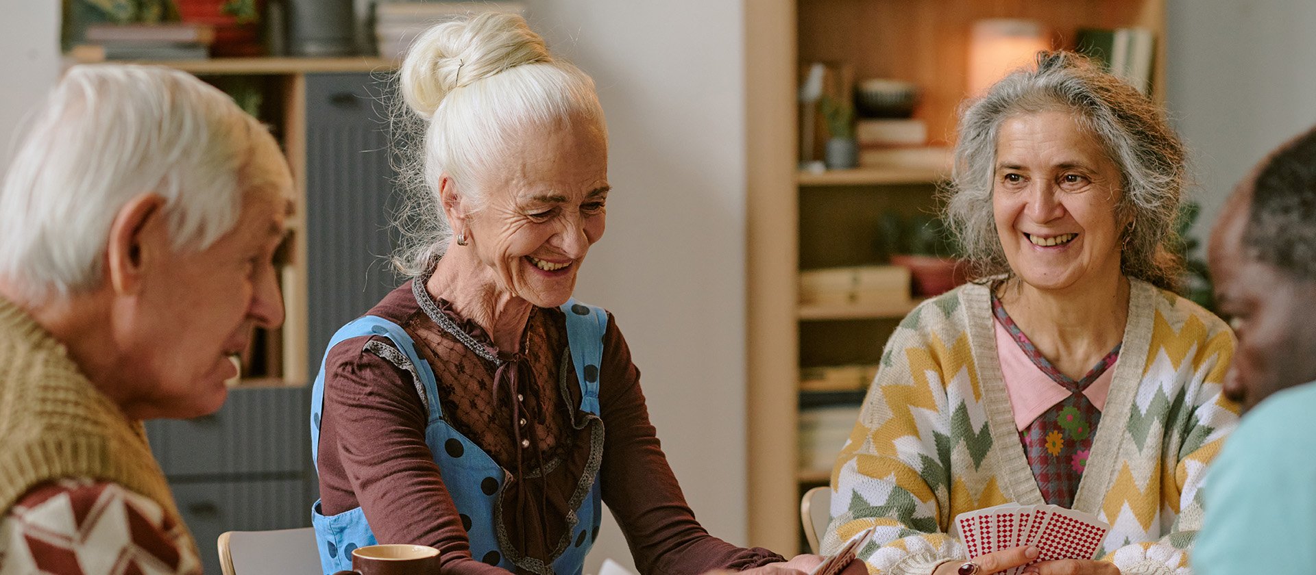 Senior living residents playing cards