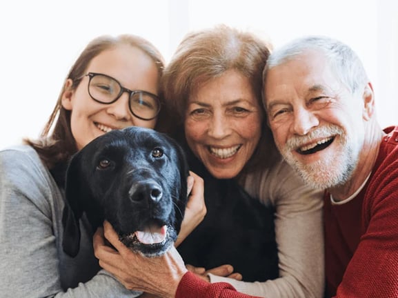 Senior living residents with grand-daughter and dog