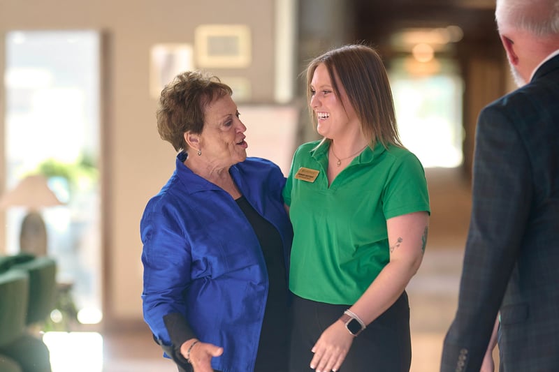 Happy senior woman and caregiver