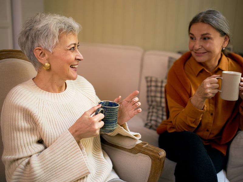 Senior living residents drinking coffee