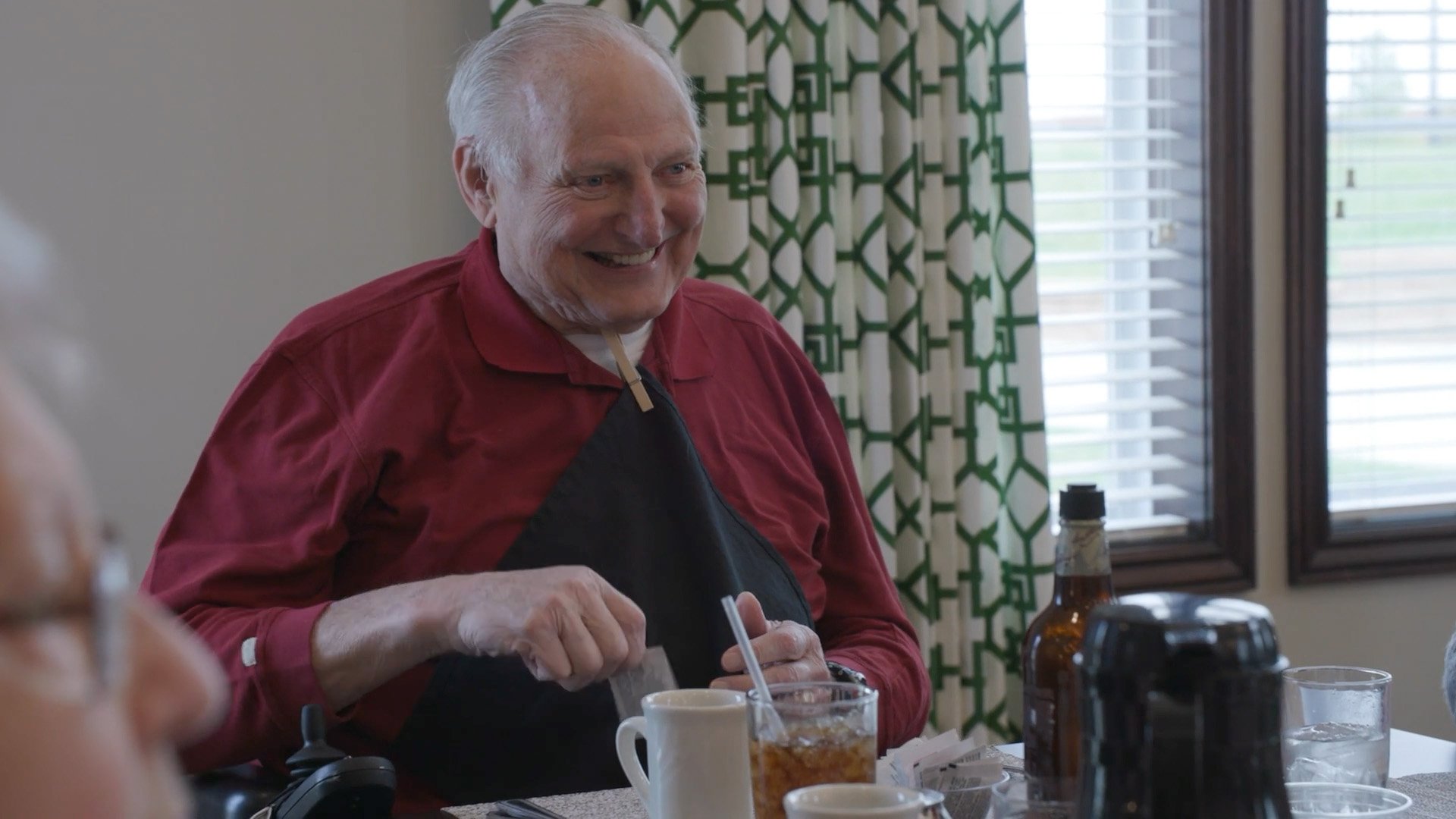 Senior men sitting at a dining table