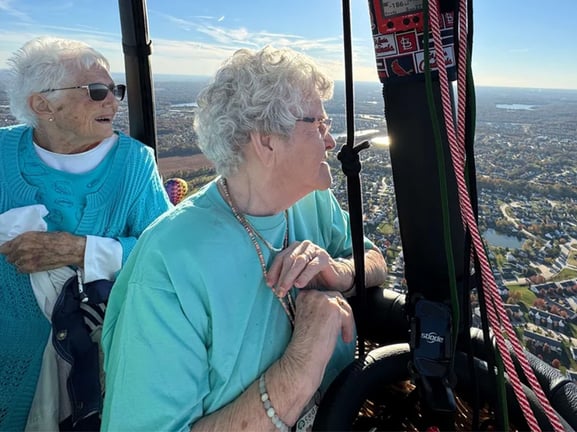 Two senior women in a hot air balloon
