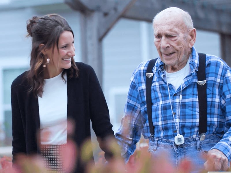 Memory care resident with senior living staff member