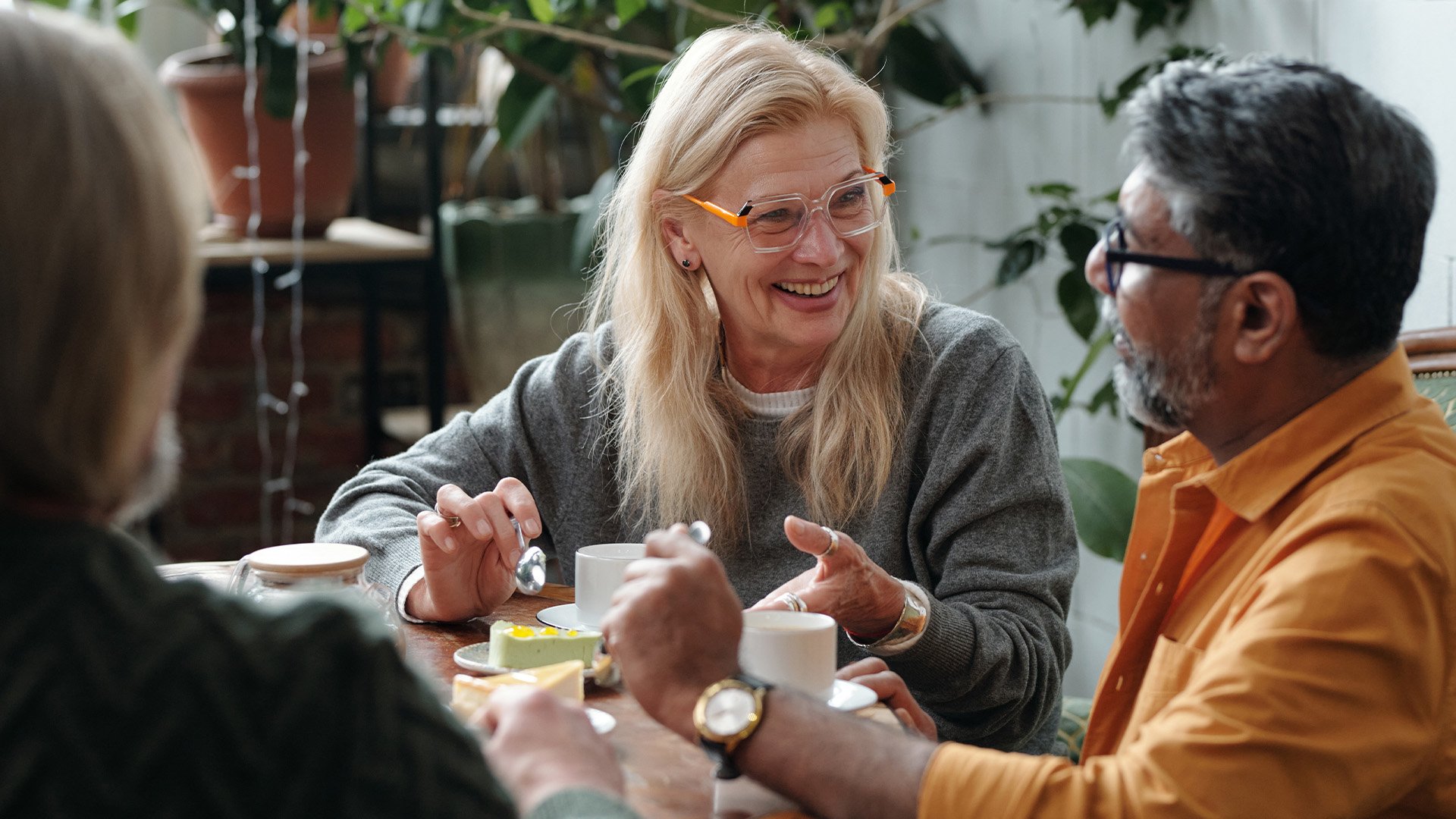 Group of seniors chatting over tea