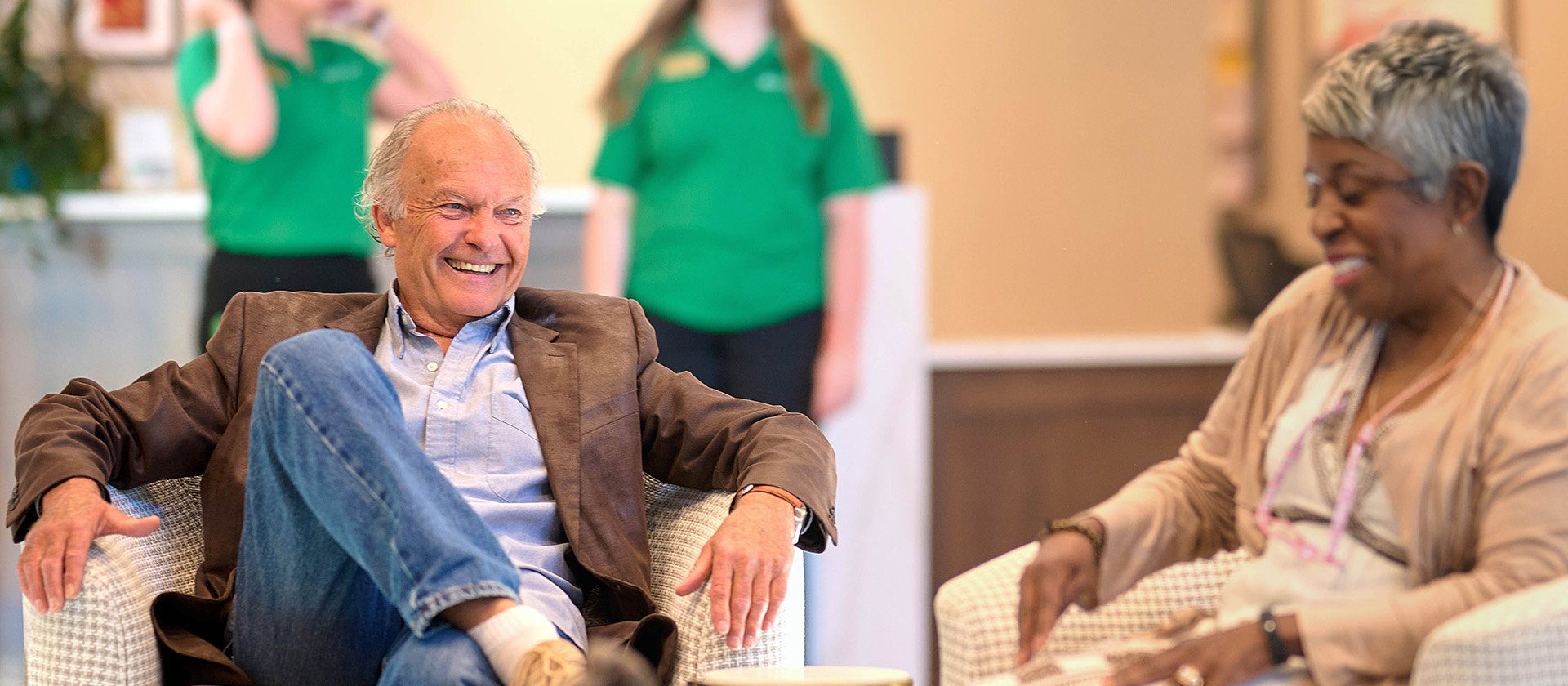 Group of seniors chatting in the social room