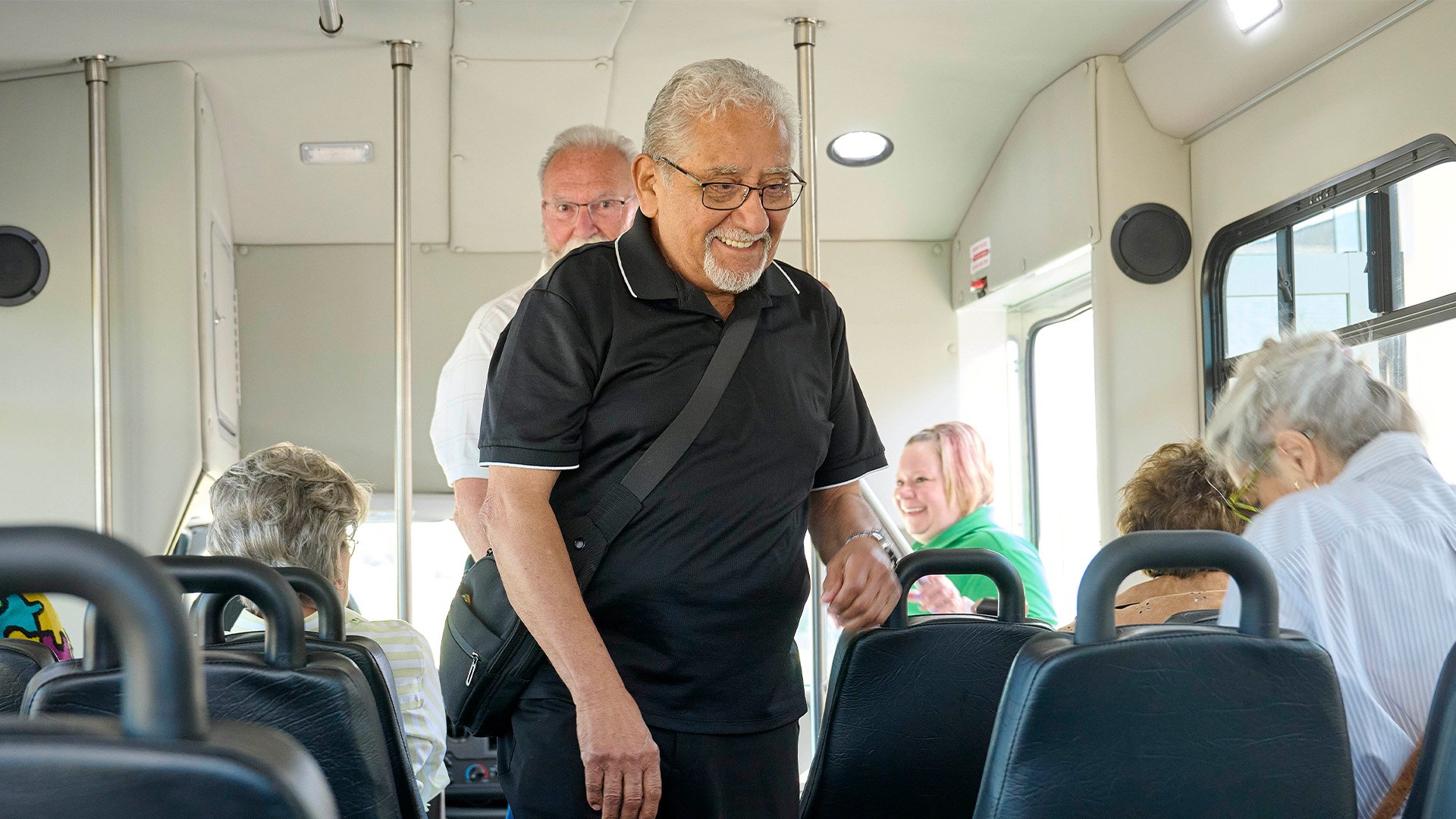 Senior man getting in a bus
