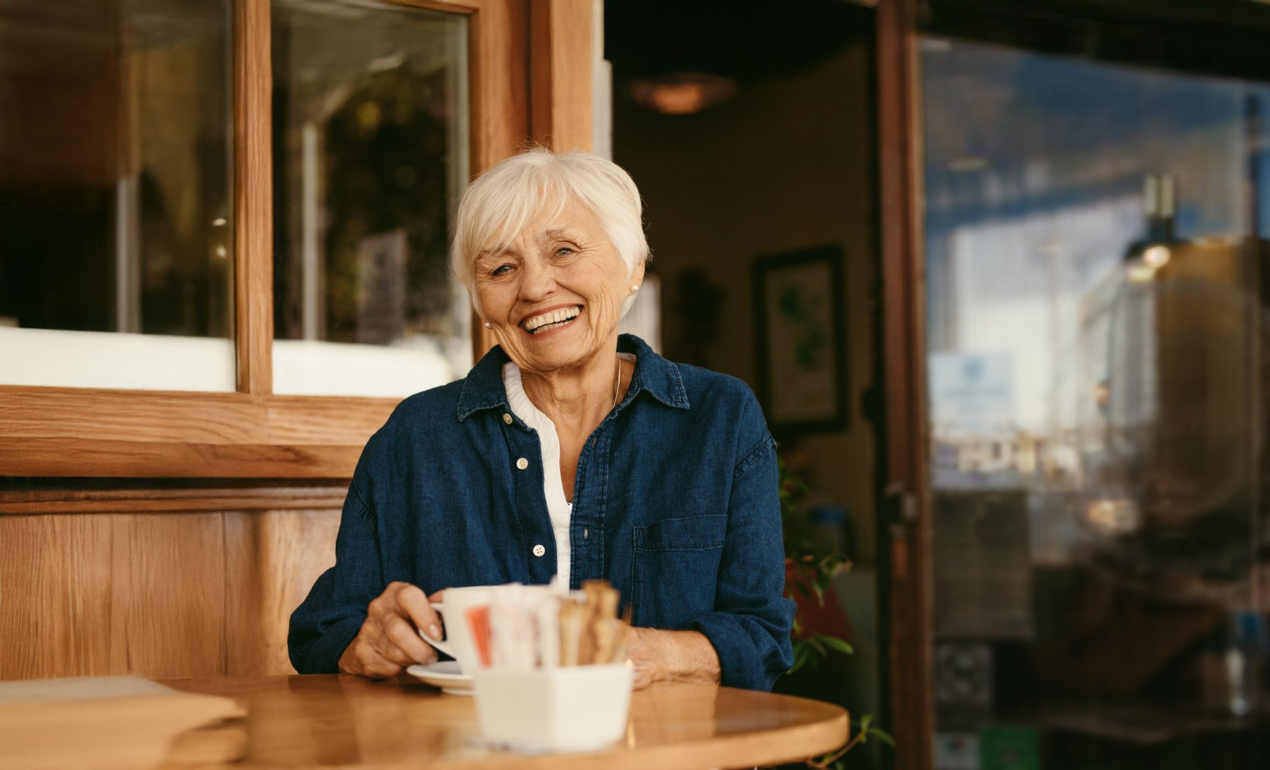 senior woman sitting at cafe