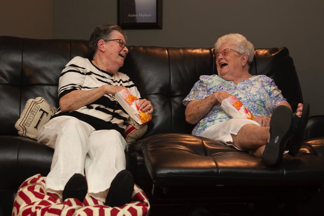 Residents Enjoying Popcorn and Watching A Movie