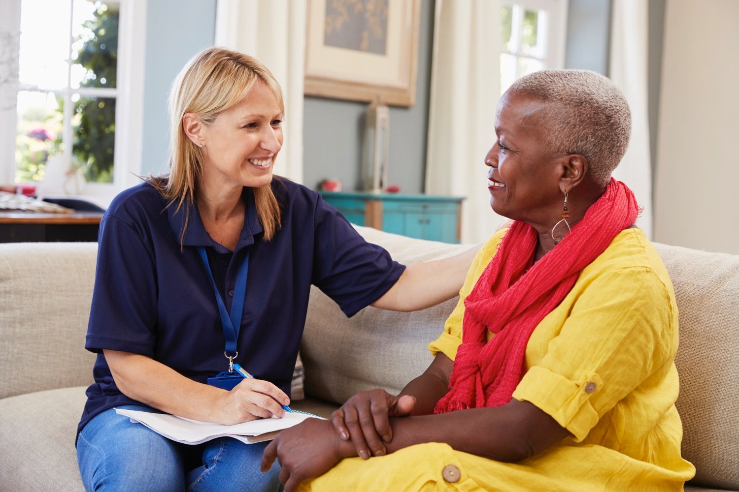 Caregiver with senior on couch