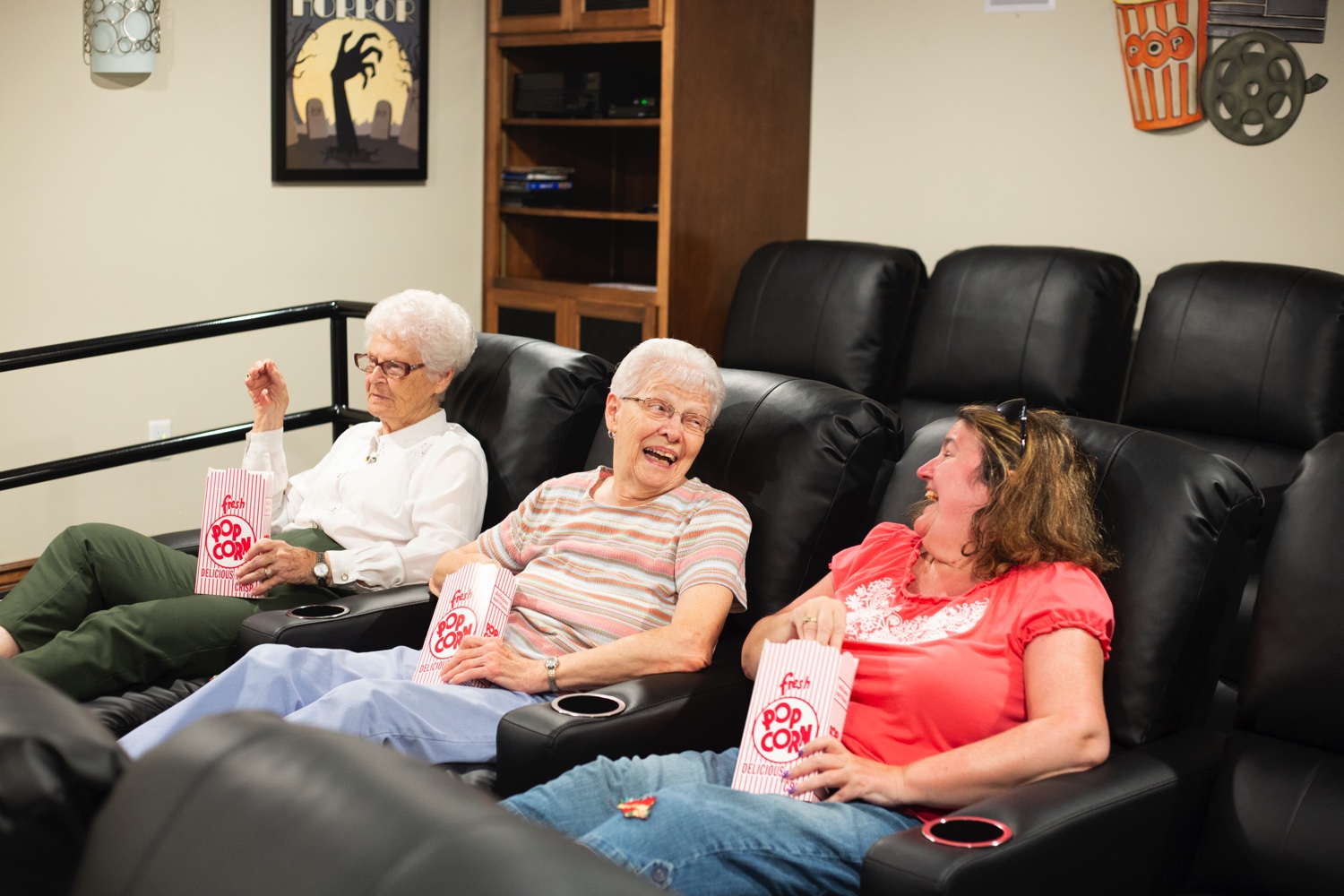 seniors sitting in home theater