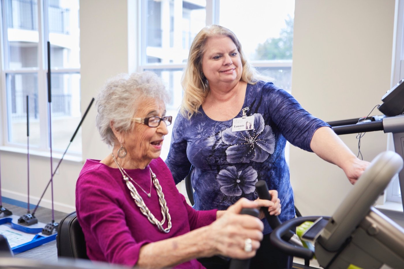 Caregiver Helping Resident Exercise