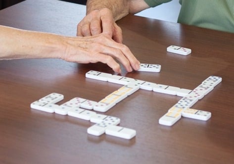 Friends playing dominoes