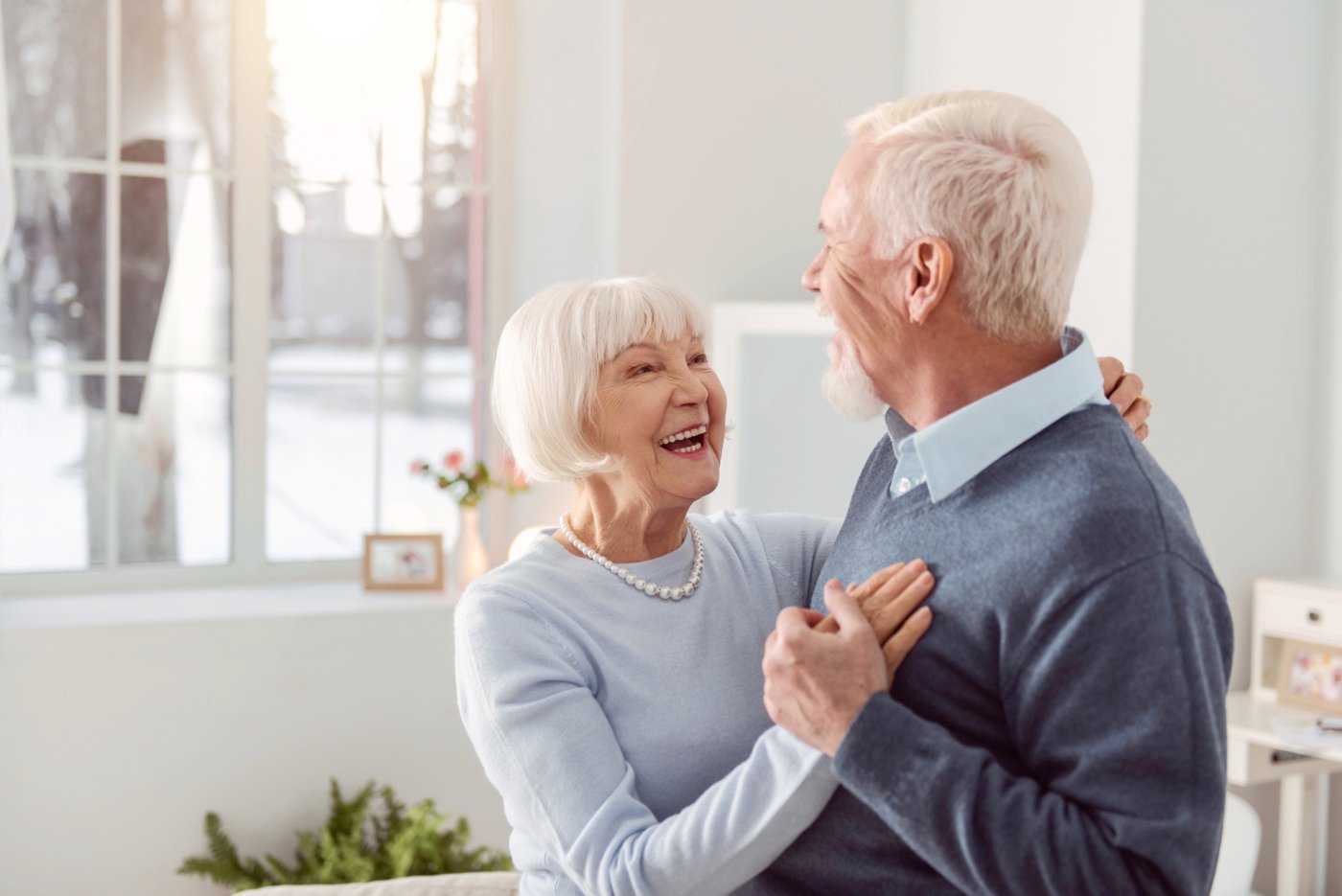 A senior couple dancing together