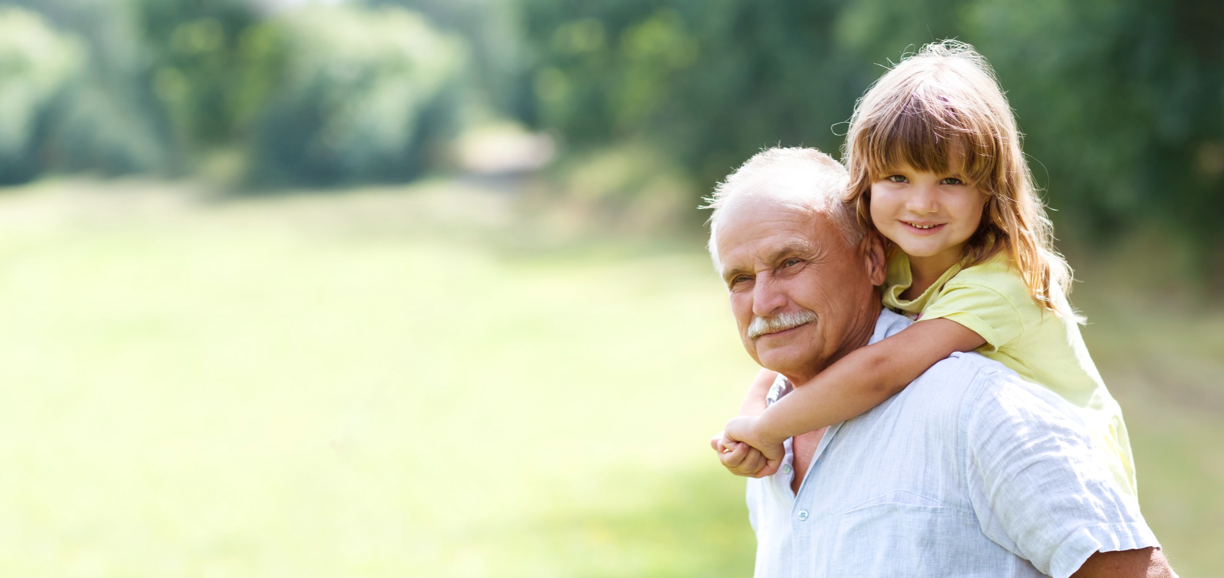 Little girl hugs grandfather