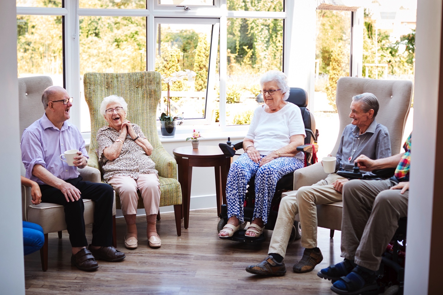 Residents sitting in chairs and talking