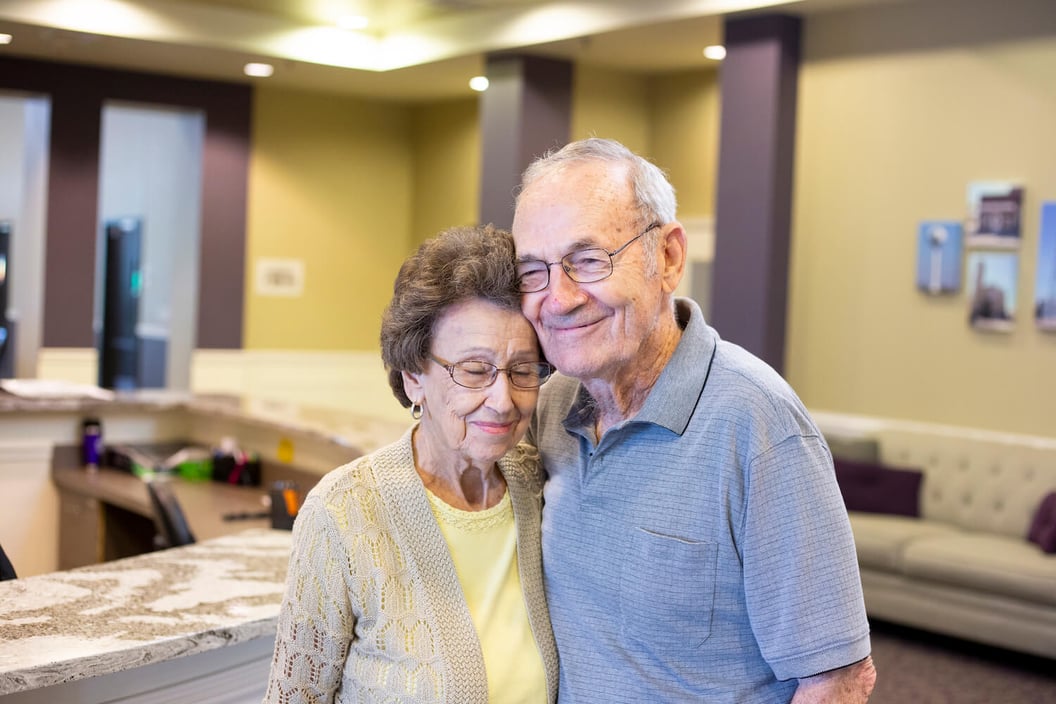 Two residents hugging