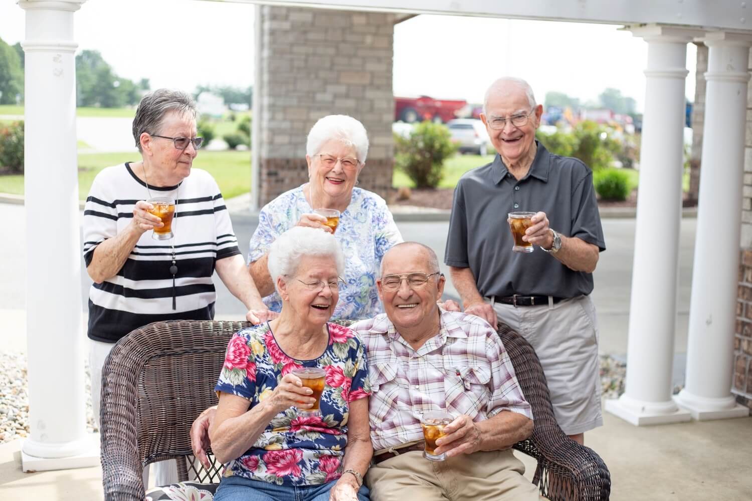 Residents toasting drinks together outside