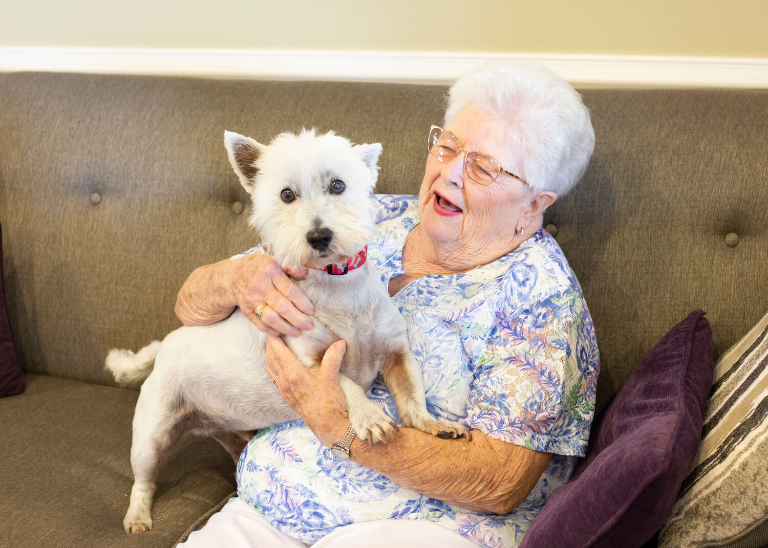 senior resident Holding Dog