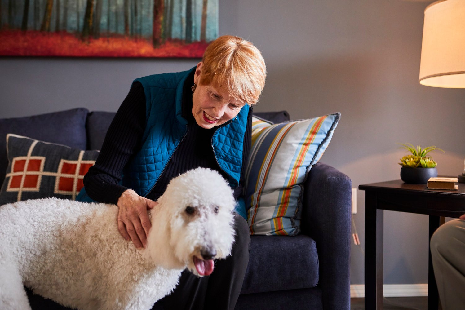 Senior Woman Petting Dog