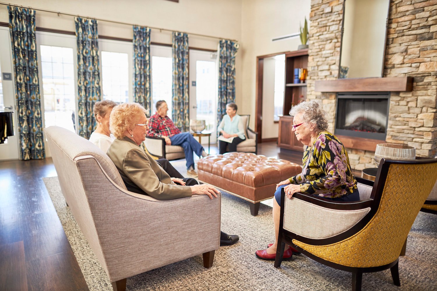 Residents laughing together in a living room