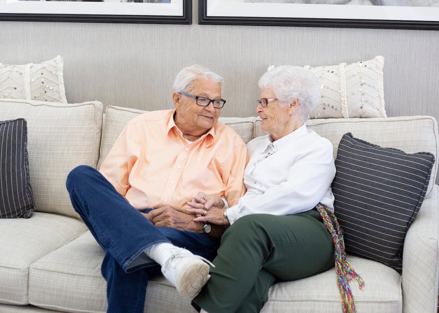 Senior couple sitting on couch Senior couple sitting on couch