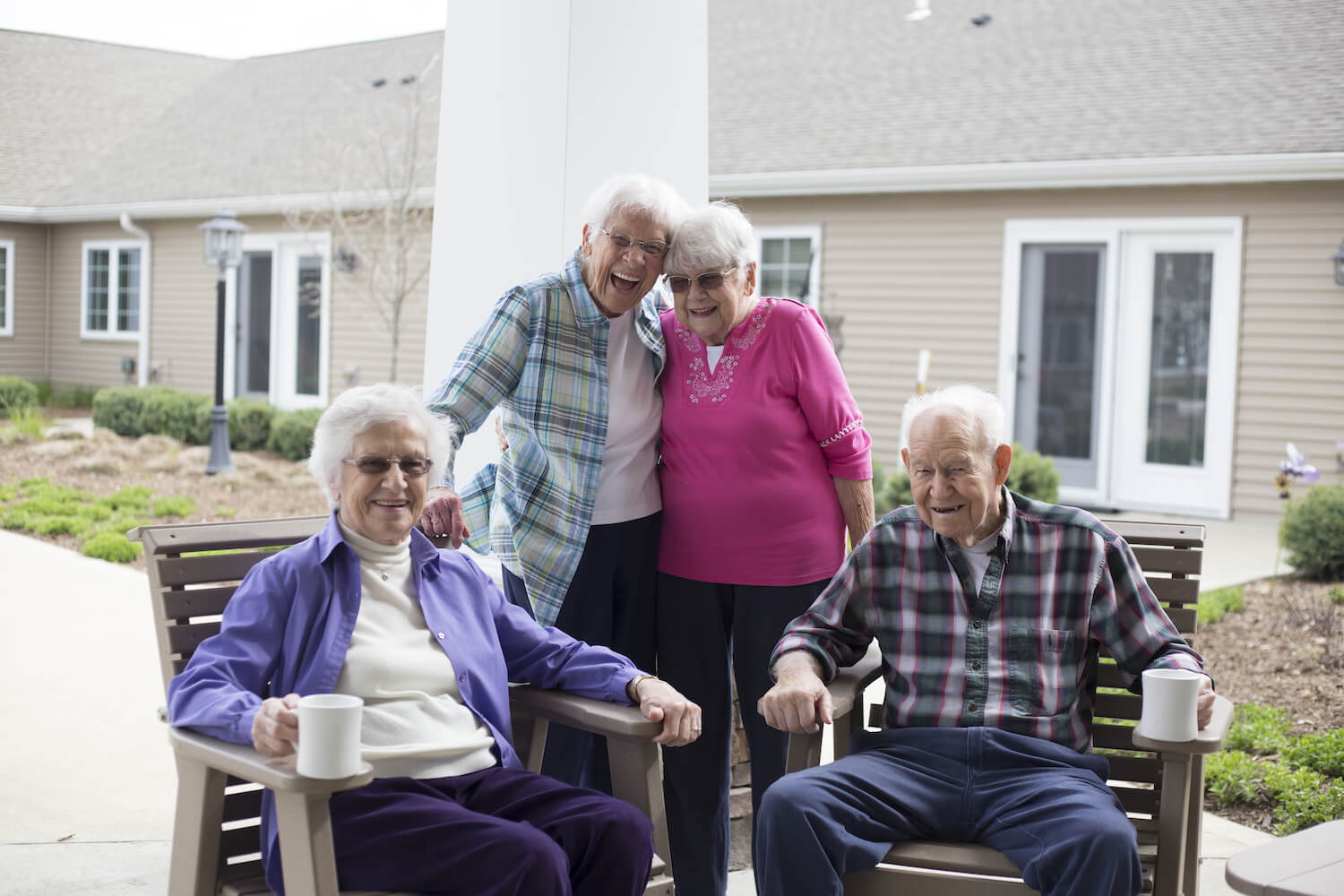 A group of residents enjoying coffee outside together