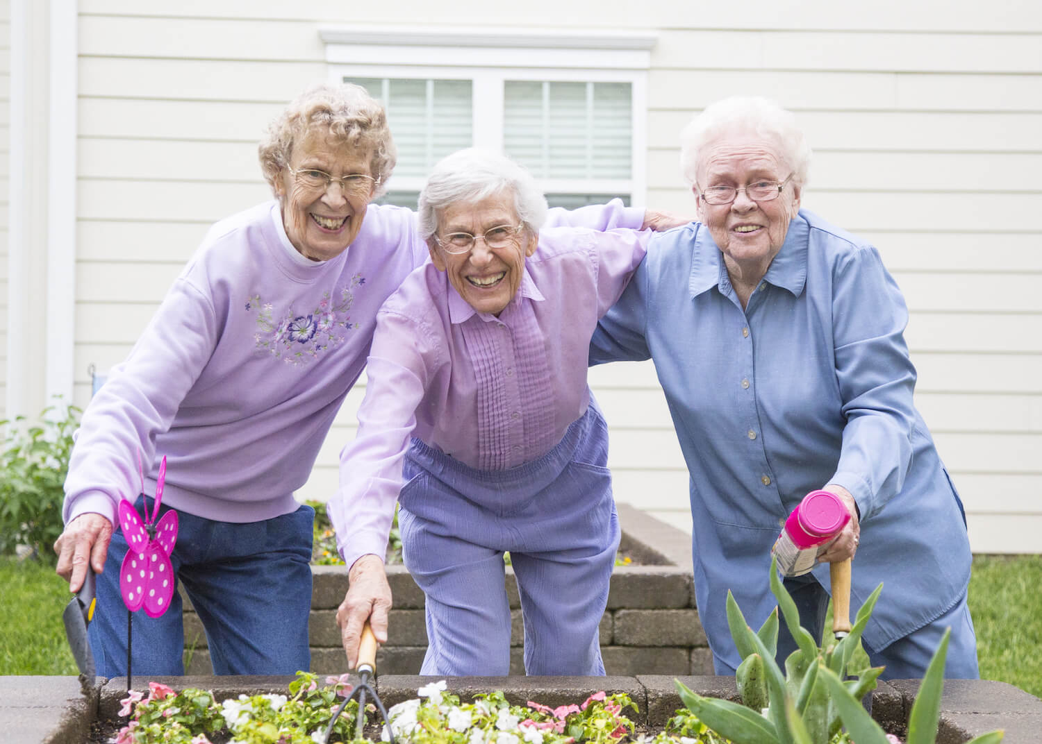 Senior women hugging in the garden