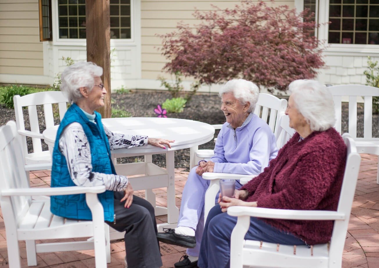 seniors sitting outside together