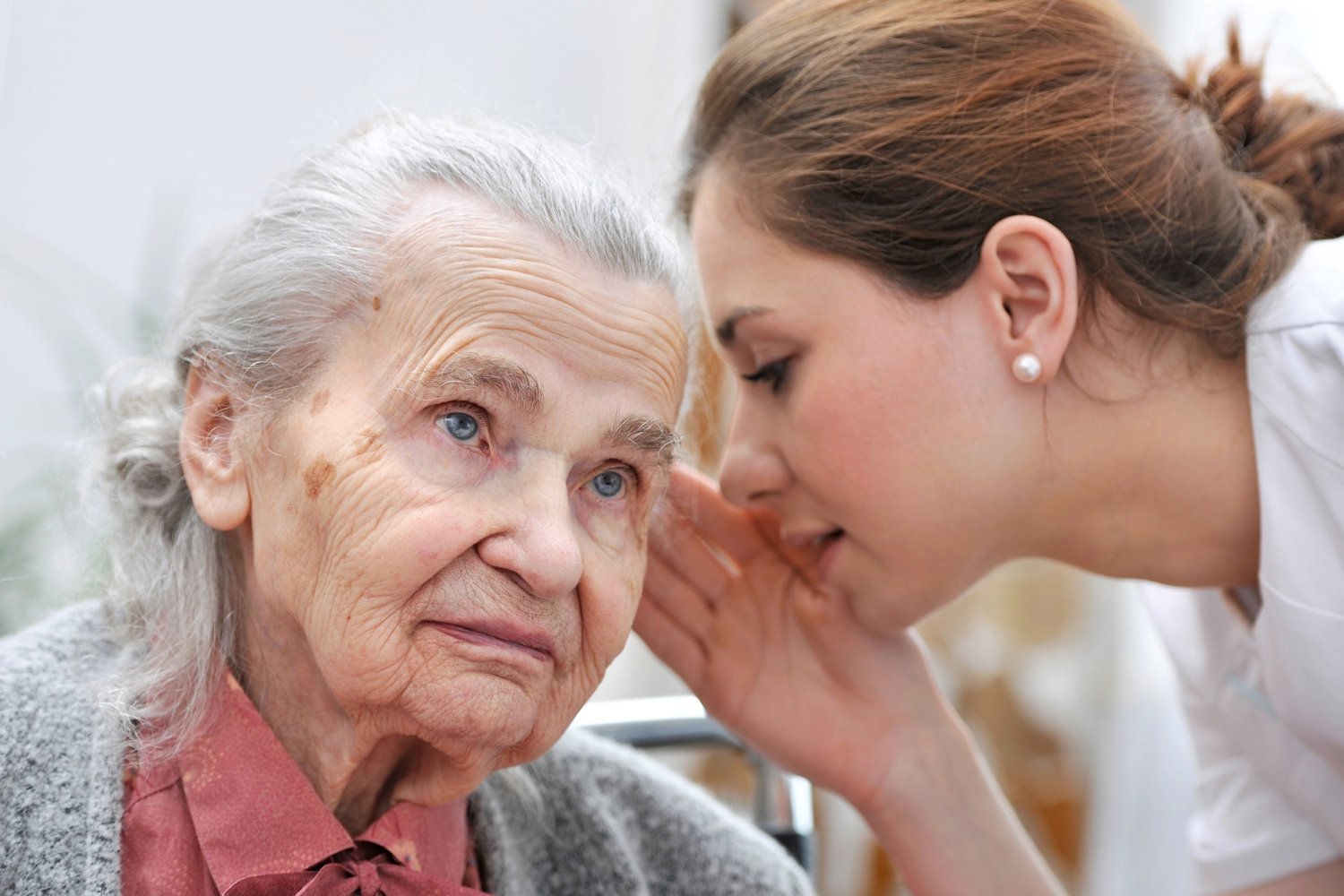A staff member speaking with a senior resident