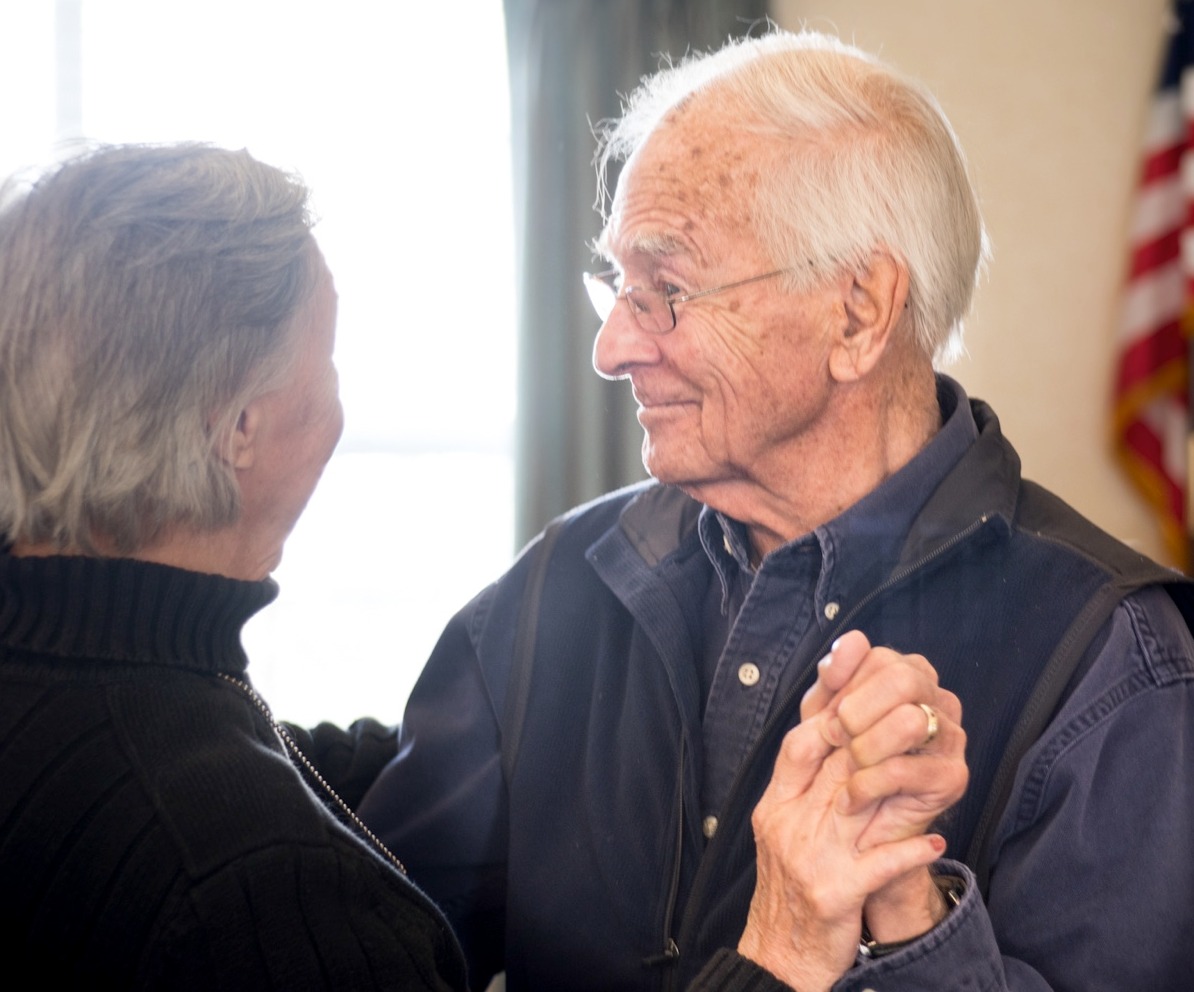 A senior couple dancing