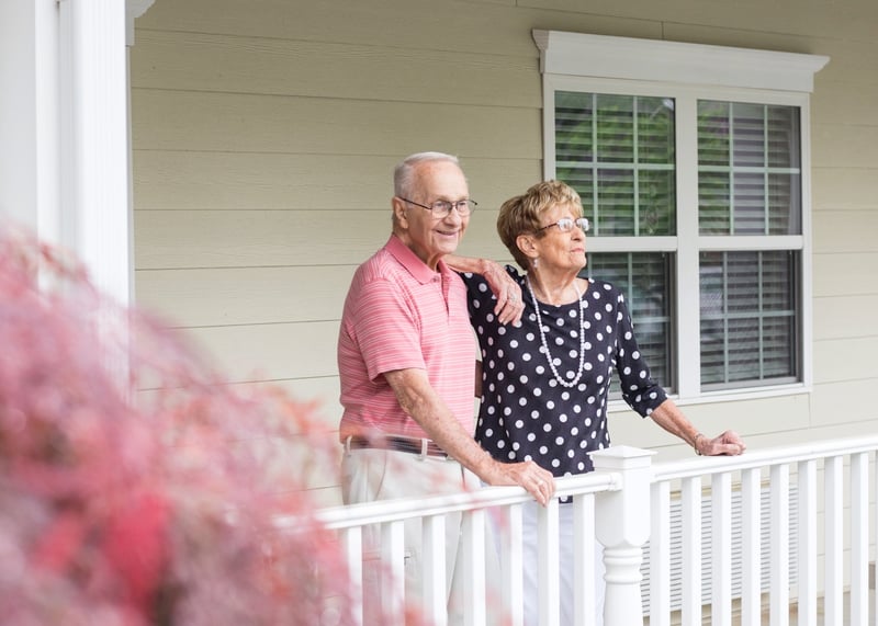 A Cedarhurst resident couple smiles outside together