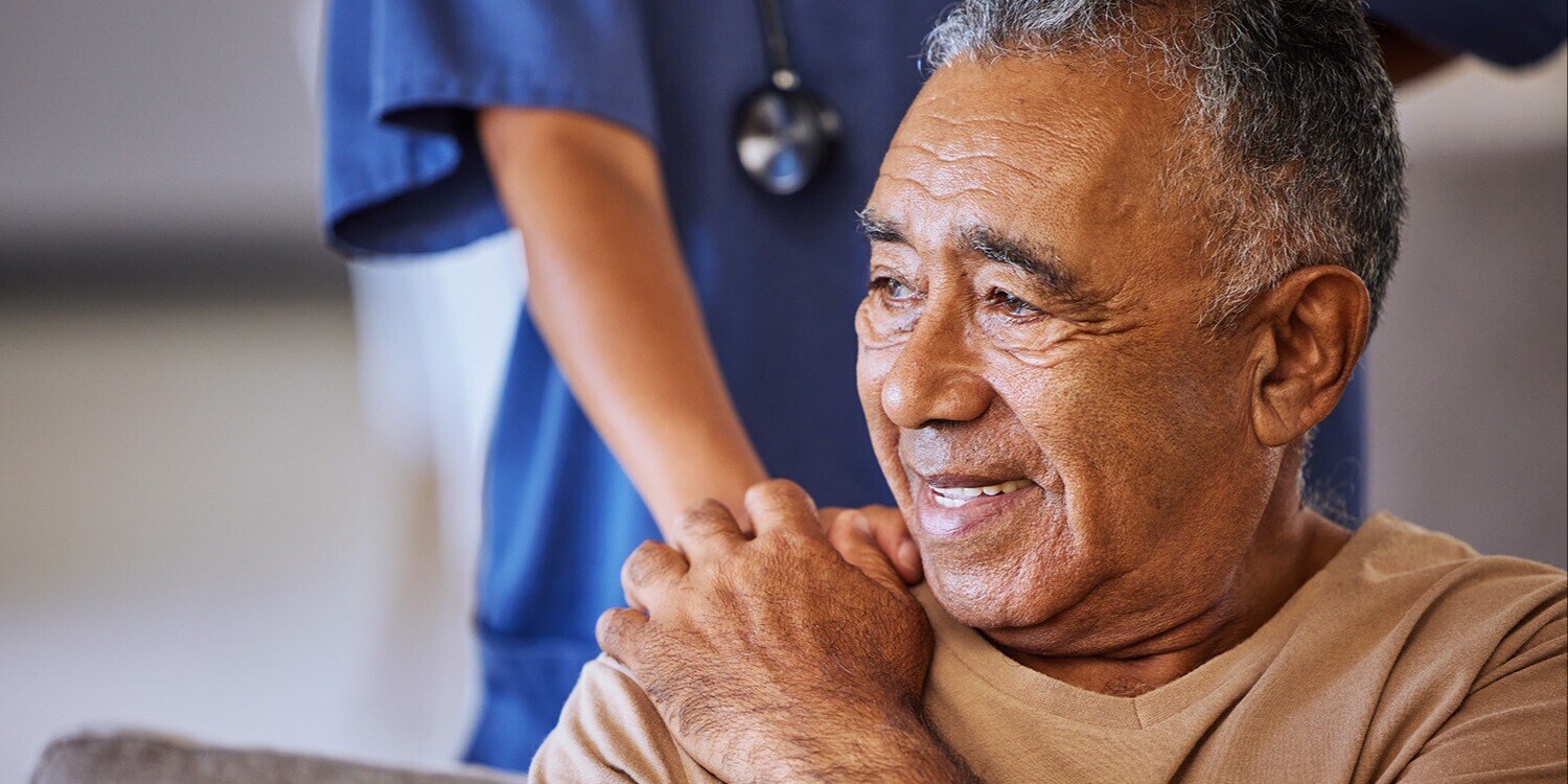 Senior man handing hands with caregiver