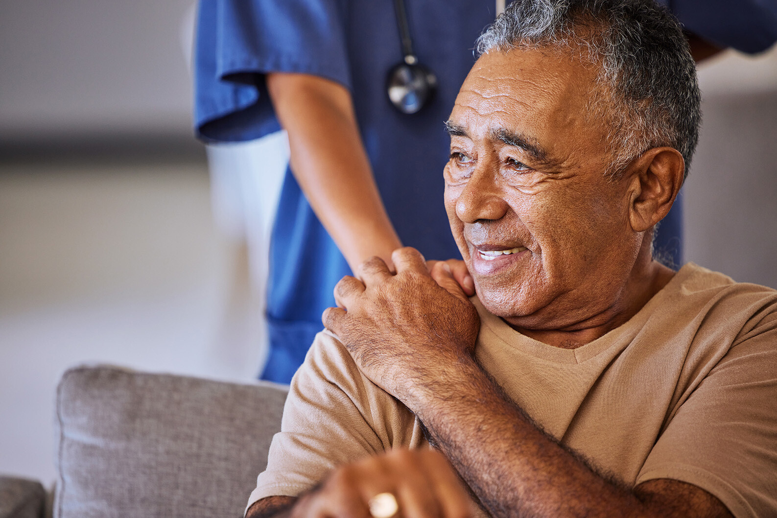 Senior man handing hands with caregiver