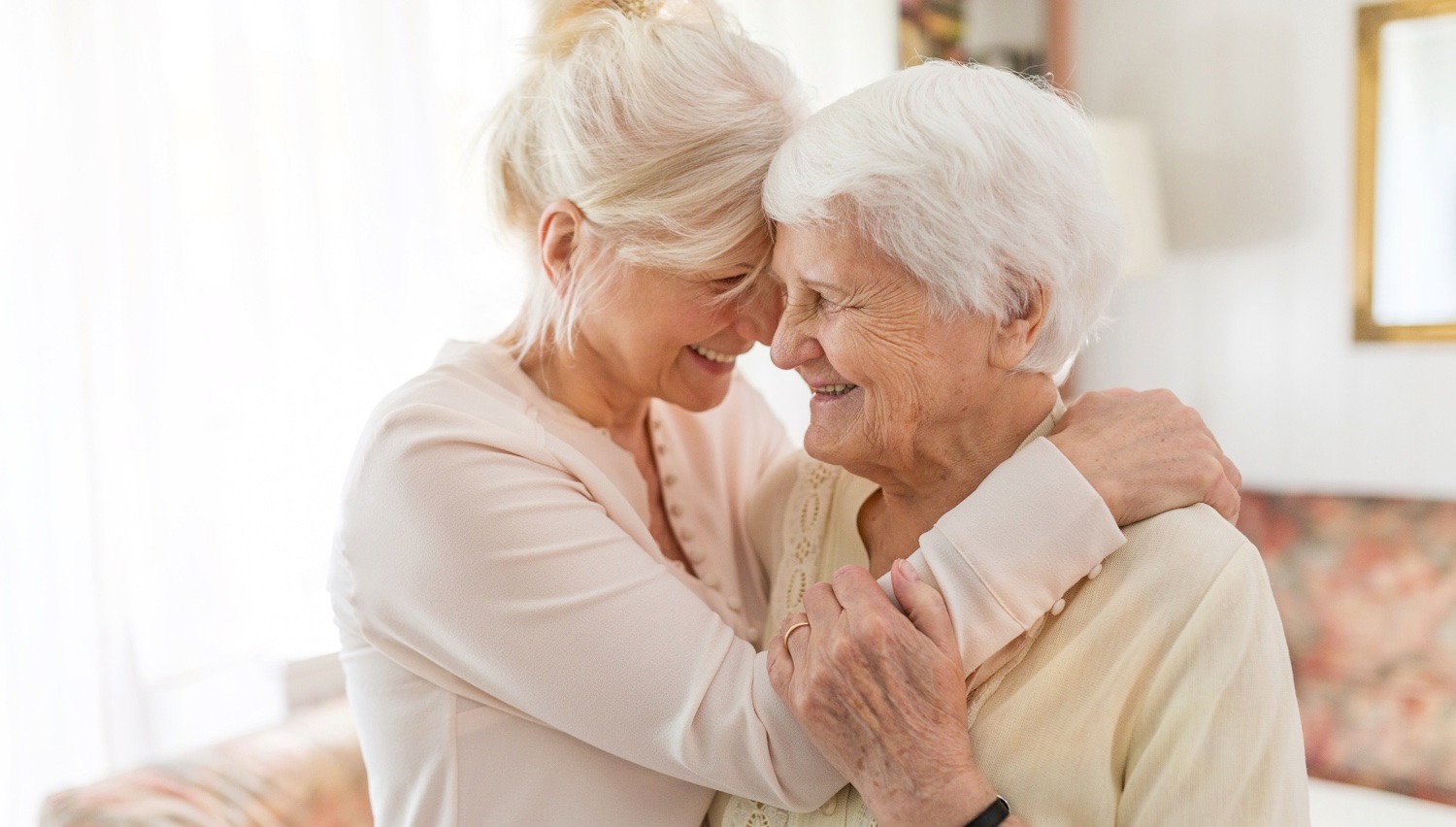Senior woman spending embracing her daughter