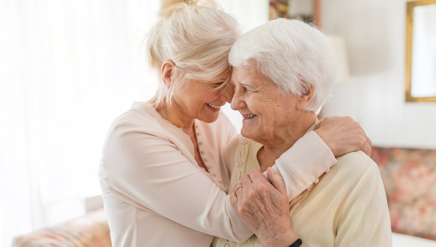 Senior woman embracing her daughter