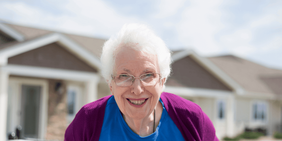A smiling senior living resident
