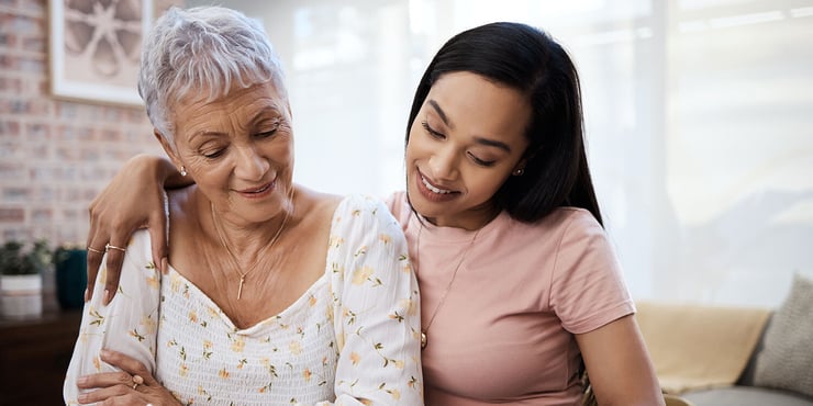Woman with senior mother looking at assisted living options