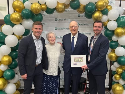 Almir Sajtovic poses for a photo at a Cedarhurst community Grand Opening event