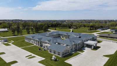 A wide angle photo of the building exterior of the newly constructed Cedarhurst Senior Living of Lincoln, NE.