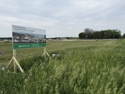 A grassy lot where the groundbreaking and construction for Cedarhurst of Ames — located in Ames, Iowa — is set to begin.